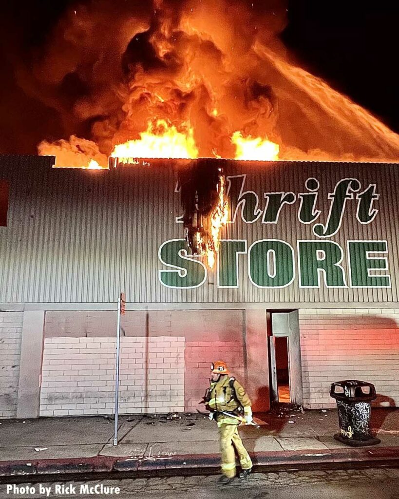 Fire burns through roof of thrift store