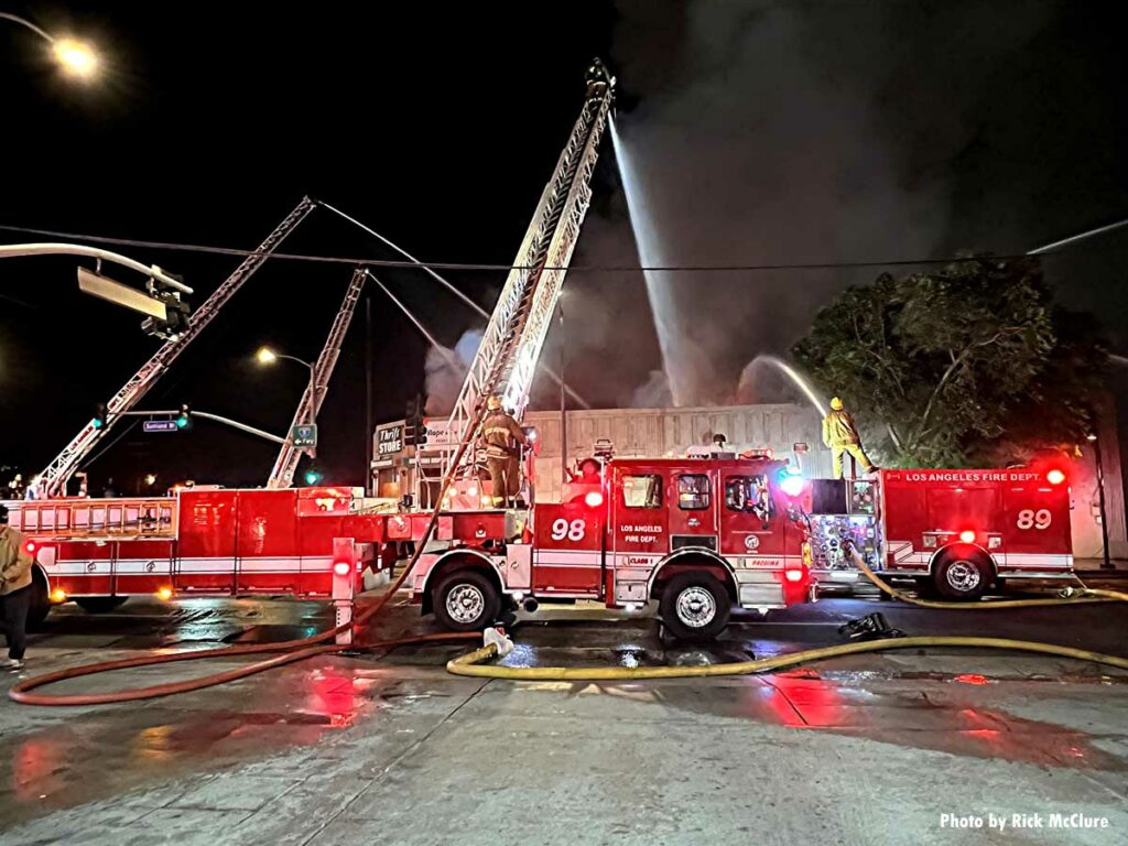 Three LAFD aerial devices in use with master streams