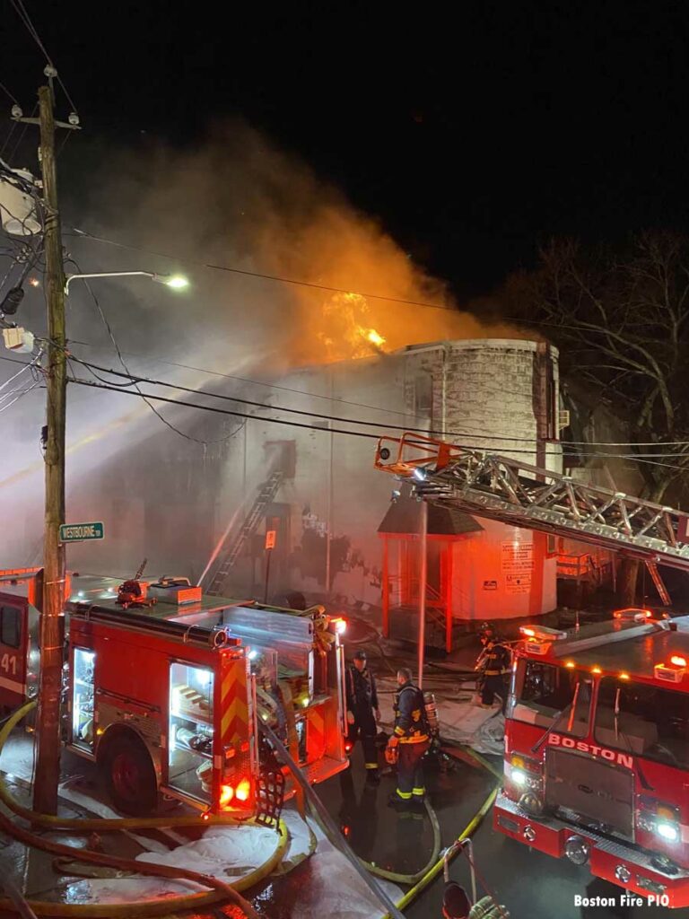 Flames shoot from the roof at eight-alarm Boston fire