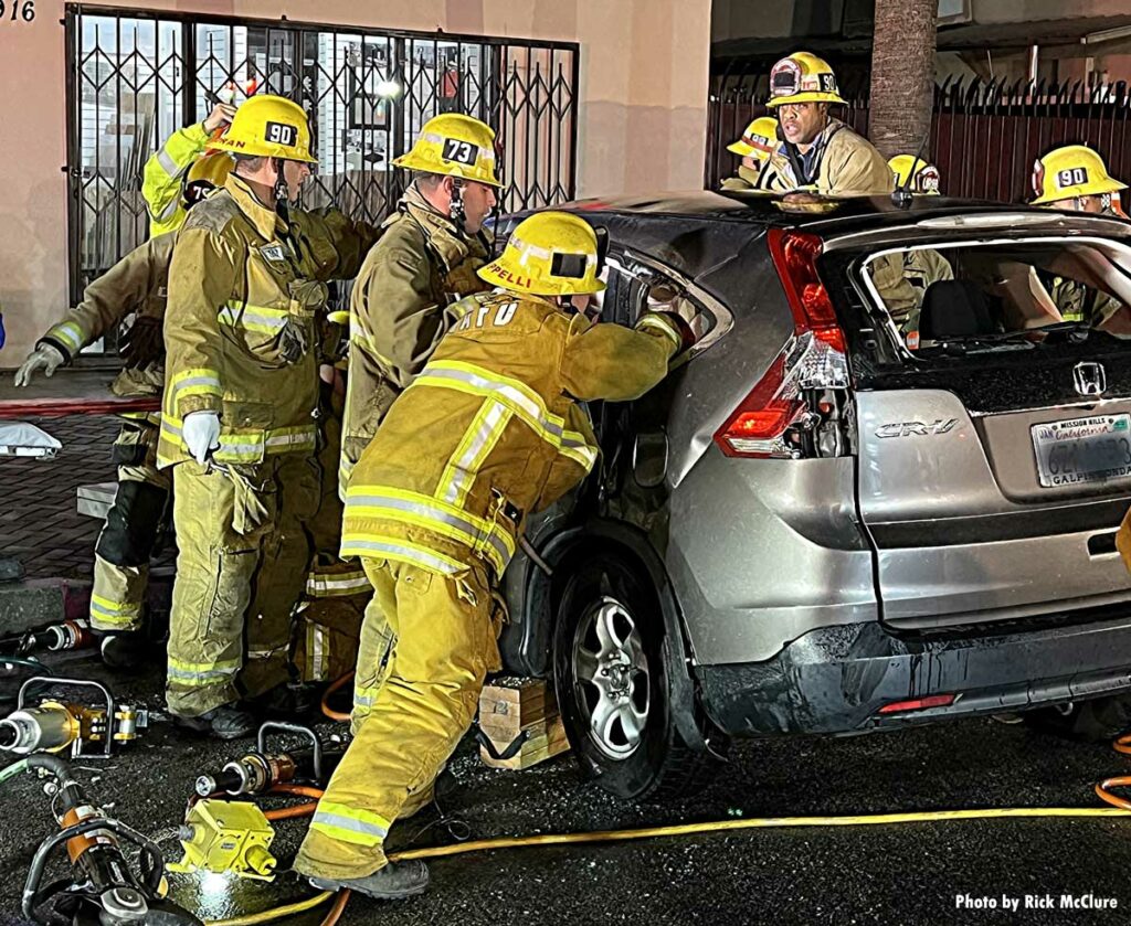 Firefighters work to remove victim at crash in Los Angeles