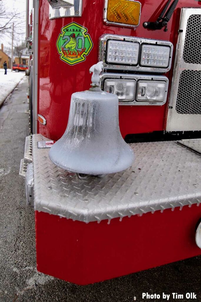 Ice-covered bell on fire truck