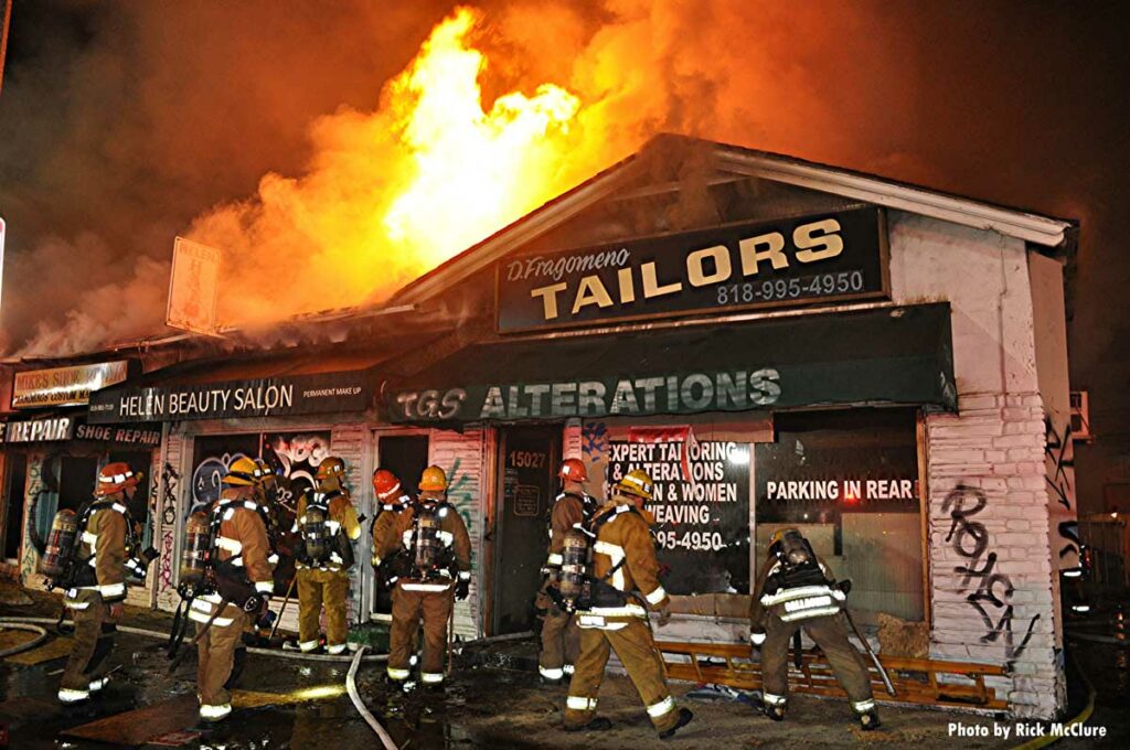 Flames shoot through roof of building in Los Angeles