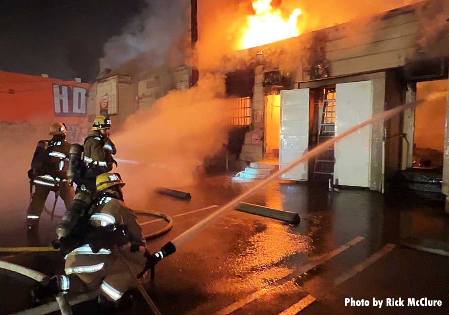 City of Los Angeles firefighters on hoseline at fire