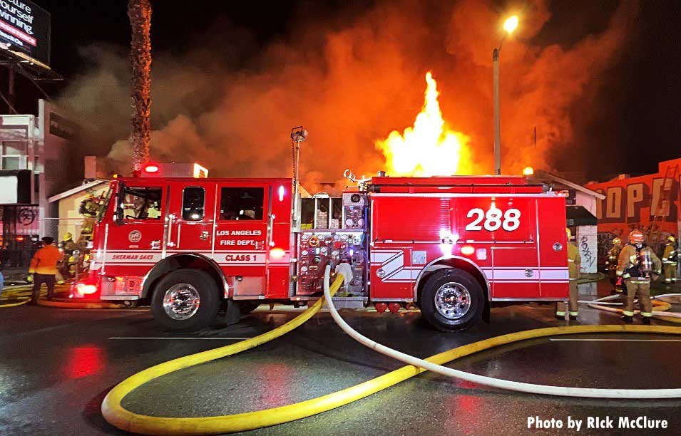 LAFD pumper with flames behind