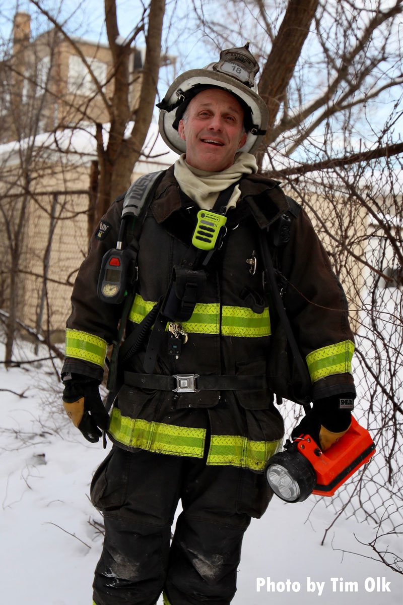 Chicago firefighter holding a flashlight