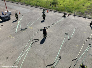 Firefighters training with fire hose