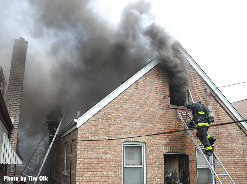 Chicago firefighters battle fire in knee walls