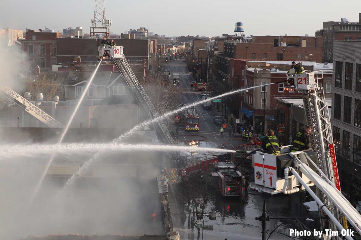 Chicago Squad 1 and two tower ladders with elevated streams