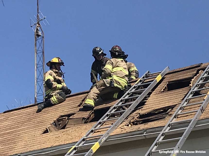 Three Springfield OH firefighters on a roof