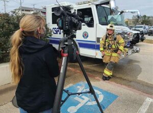 Firefighter being interviewed by reporter