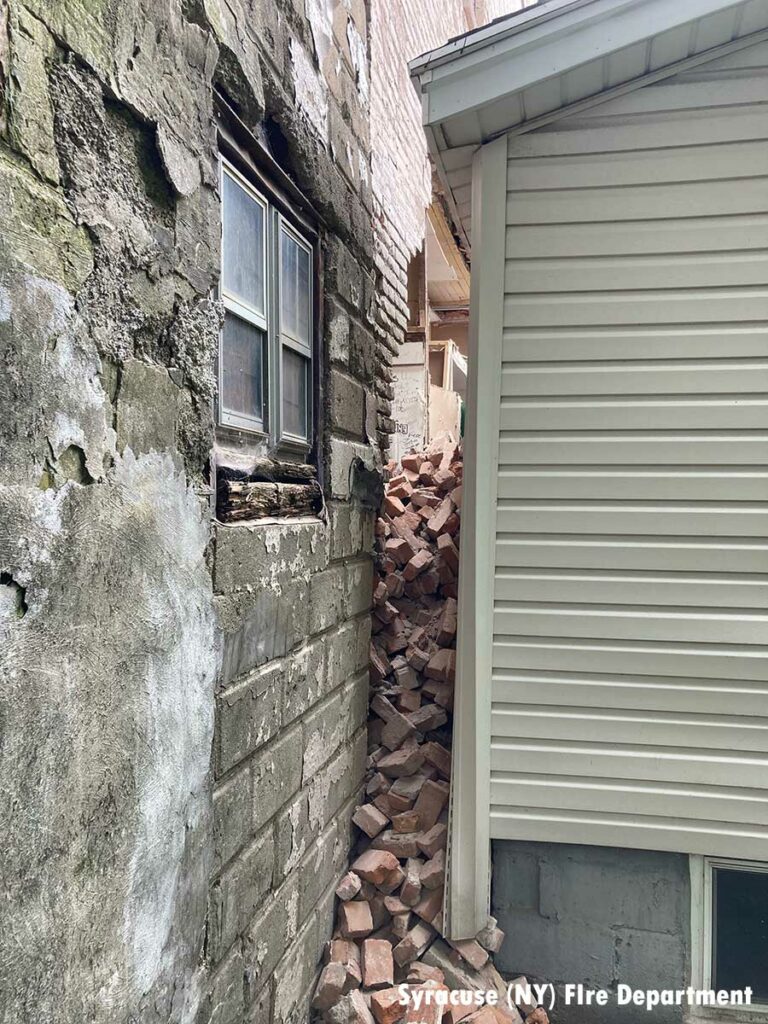 Bricks having fallen between buildings in Syracuse