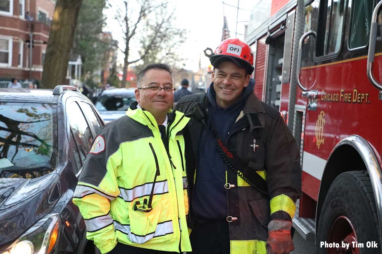 Chicago firefighters stand near fire engine