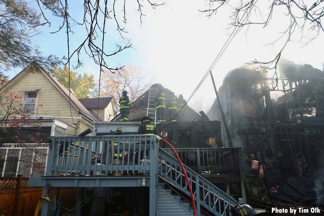 Chicago on rear porch with ladder and hoselines