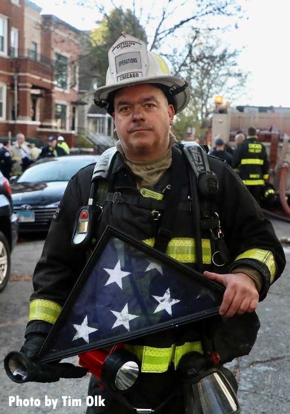 Chicago firefighter with flag pulled from fire