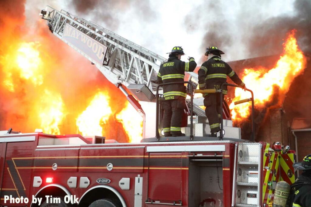 Maywood firefighter on aerial turntable at Maywood church fire