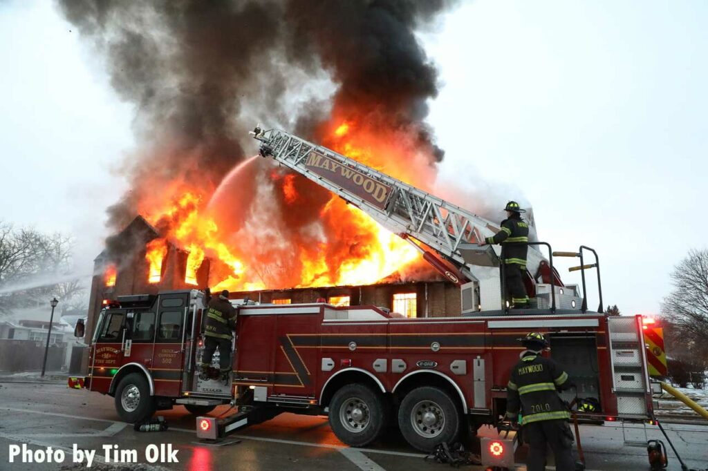 Aerial ladder flowing water at Maywood church fire