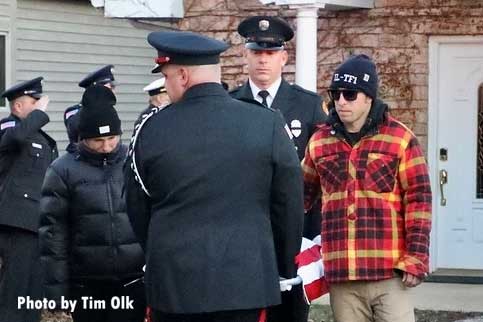 Firefighters escort body of late fire dog