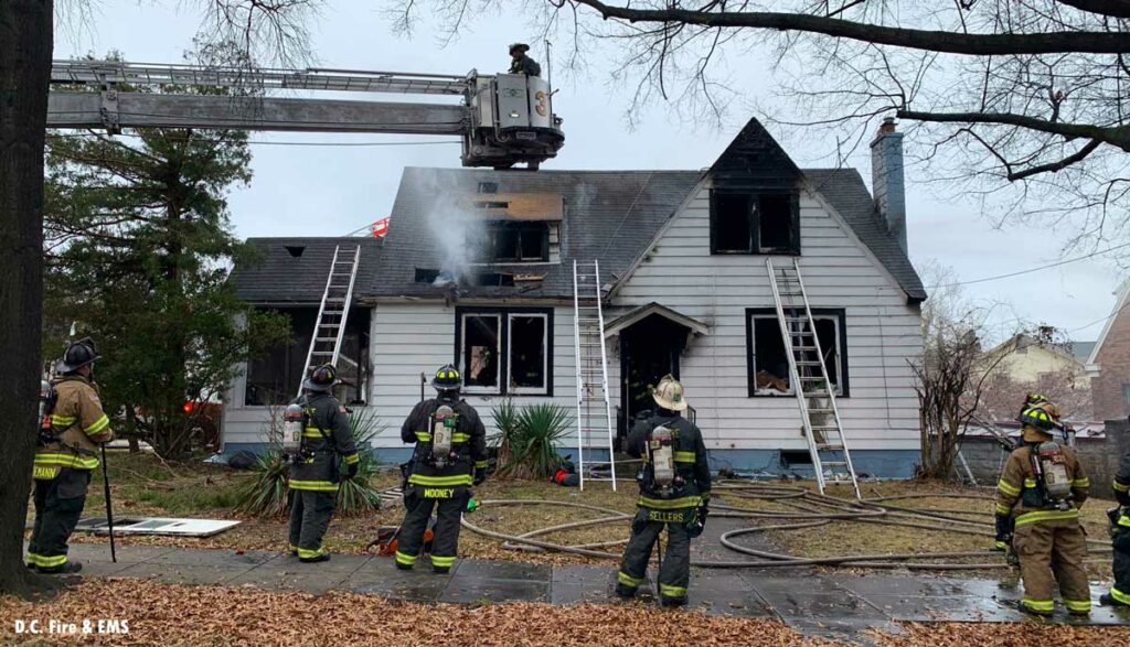 Tower ladder and ground ladders at D.C. residential fire