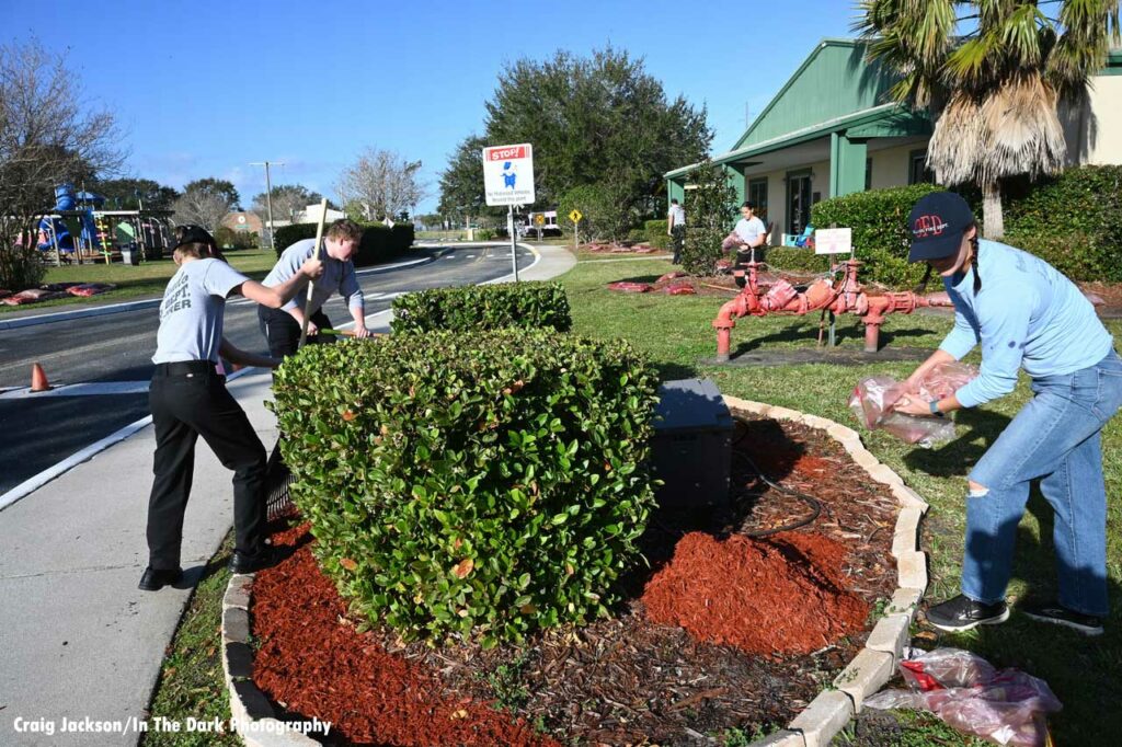 Orlando fire department volunteers help improve the grounds at Children’s Safety Village