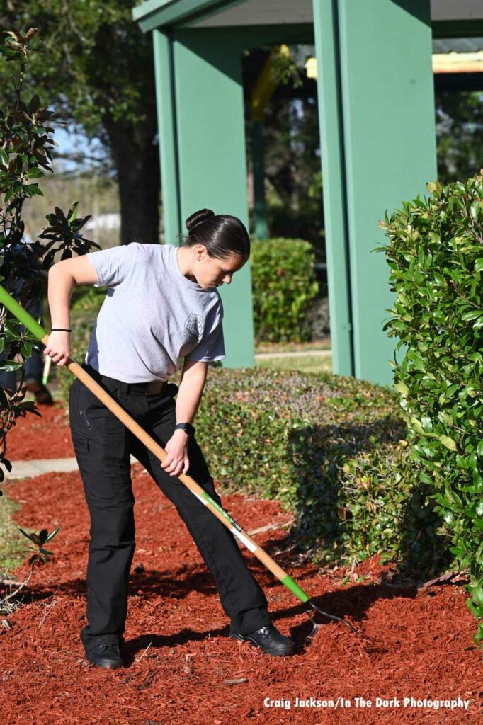 Orlando firefighter raking at Children’s Safety Village