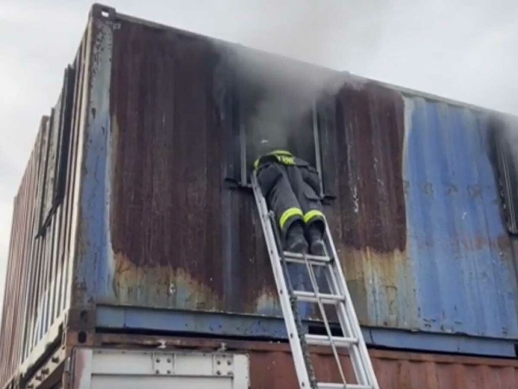 Firefighter on ladder enters window during training