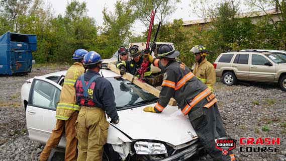 Firefighters lifting steering wheel