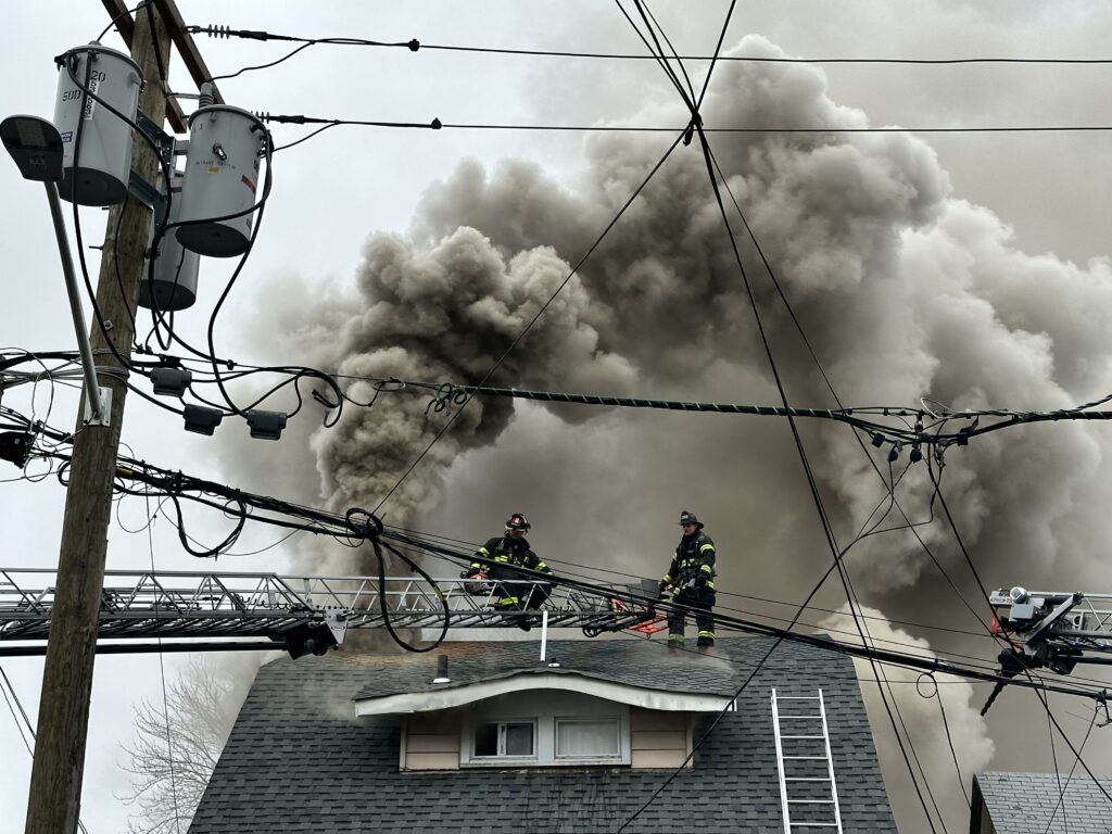 Firefighters on roof at Passaic fire