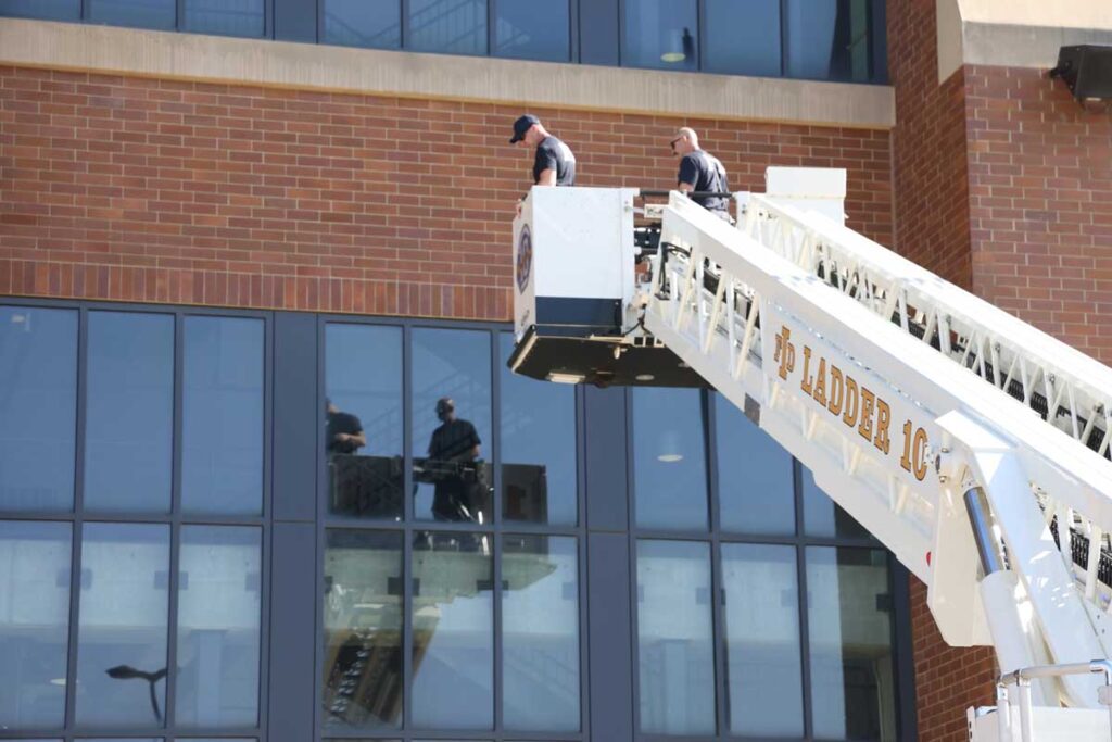 Firefighters in tower ladder bucket