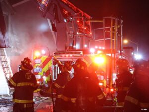 Indianapolis firefighters operate at the scene of a working apartment fire with possible entrapment