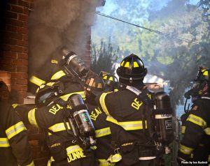 Smoke condition as firefighter climbs through window at Dearborn fire