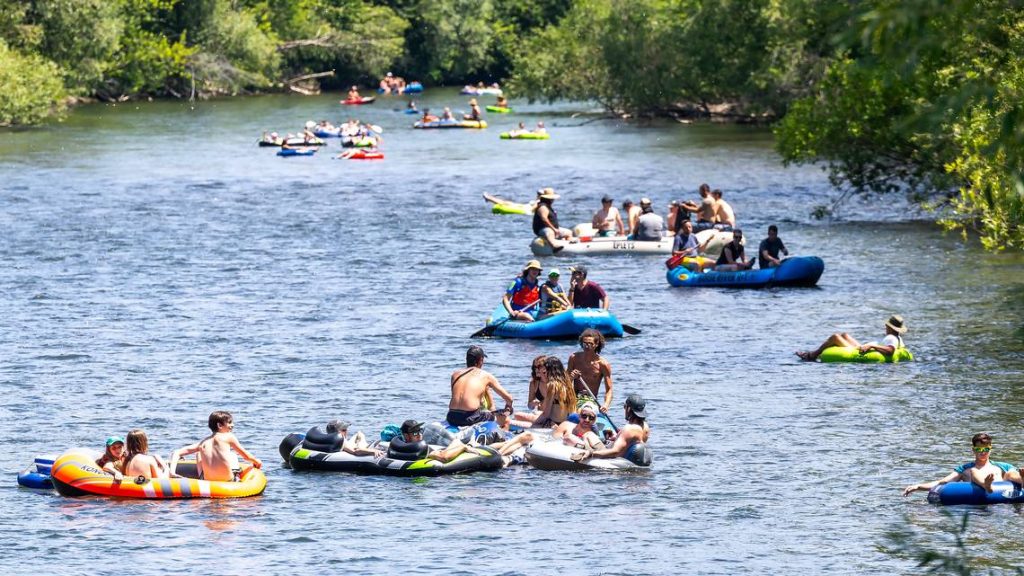 People float the Boise River near Ann Morrison Park during the heat of the day on June 29, 2024. (Sarah A. Miller)