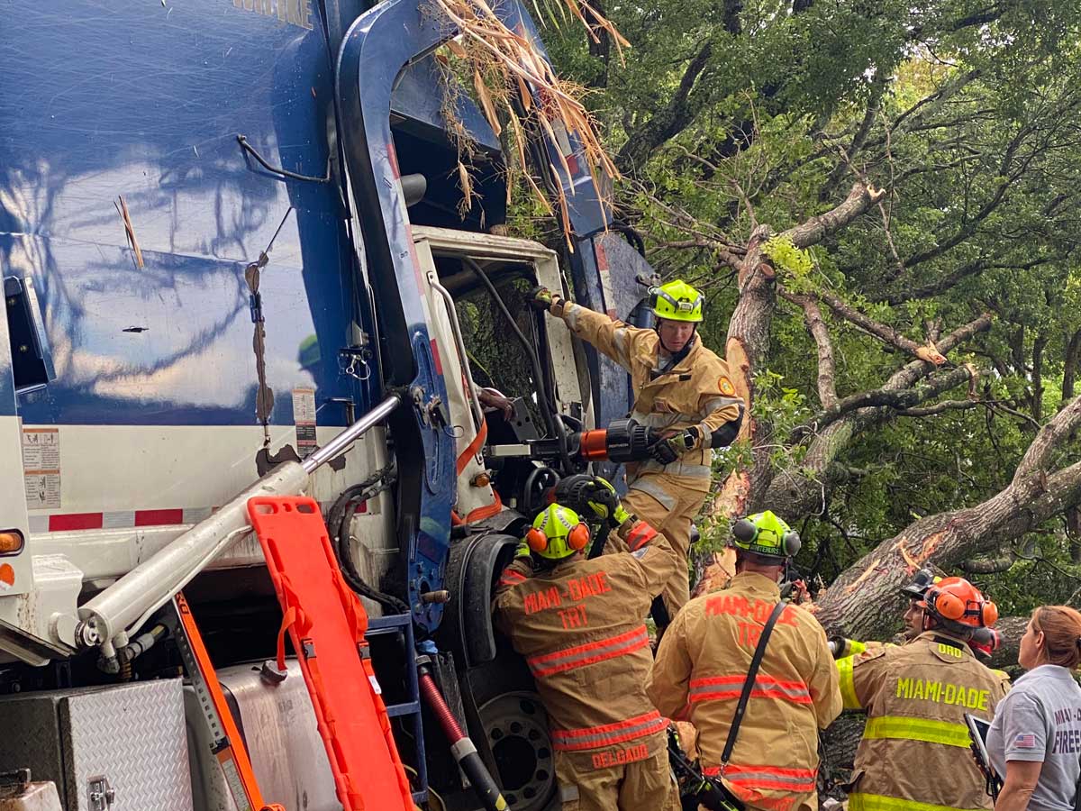 Miami Dade firefighters work to rescue victim pinned by dashboard