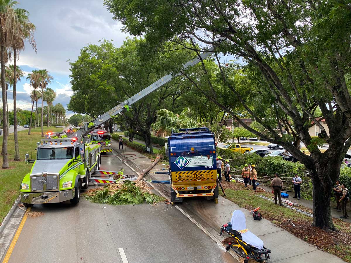 Miami Dade firefighters heavy wrecker with garbage truck crash