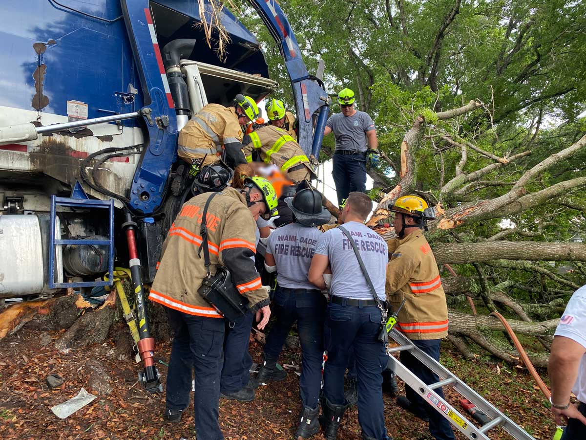 Miami Dade firefighters remove victim from crash down ladder