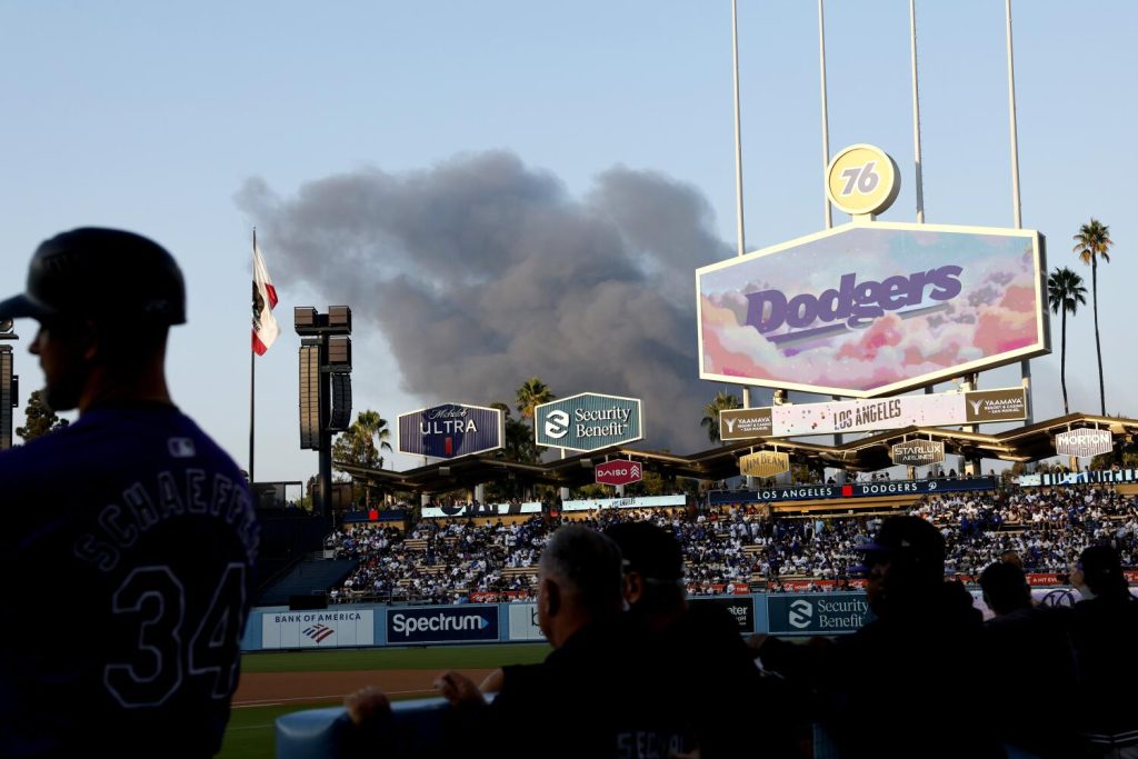 Smoke rises over Dodger Stadium