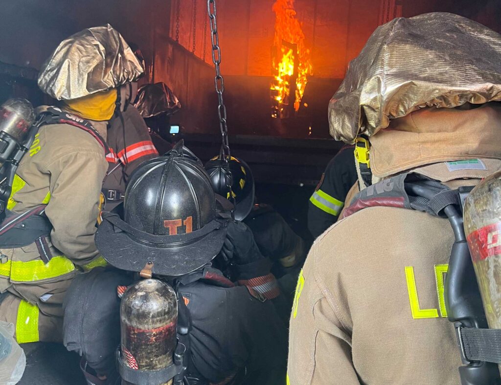 Firefighters in a flashover container