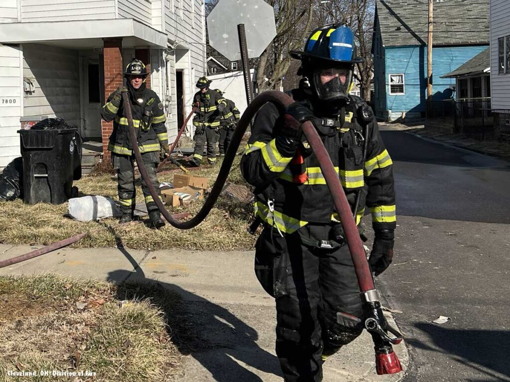 Firefighters carrying a hoseline